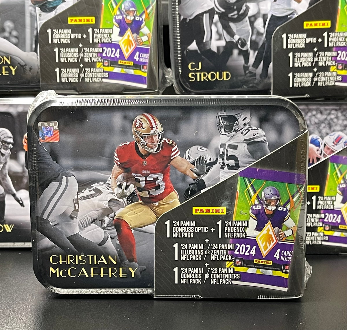 Christian McCaffrey '25 NFL MJ Holding TIN (Includes 2023-24 Panini Packs)
